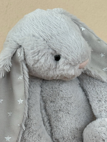 Peluche coniglietto Jellycat Medium Bashful Shimmer grigio chiaro con stelle argento coniglio-